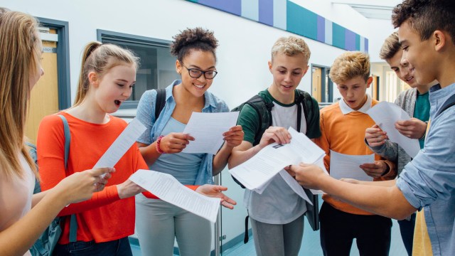 Article thumbnail: Happy students have received their exam results in high school. They are cheering and celebrating.